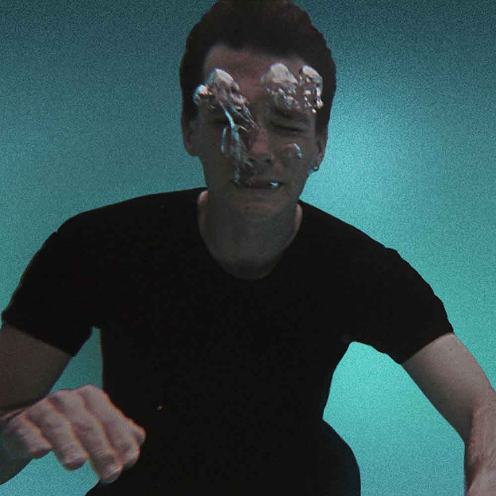 Photograph of Timothy Fairless exhaling underwater.